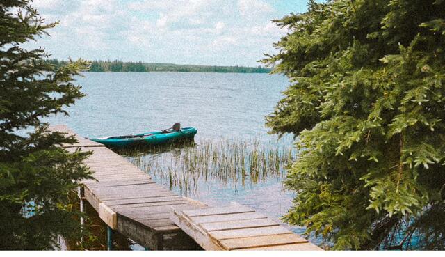 Kayaks staged off the dock on calm water