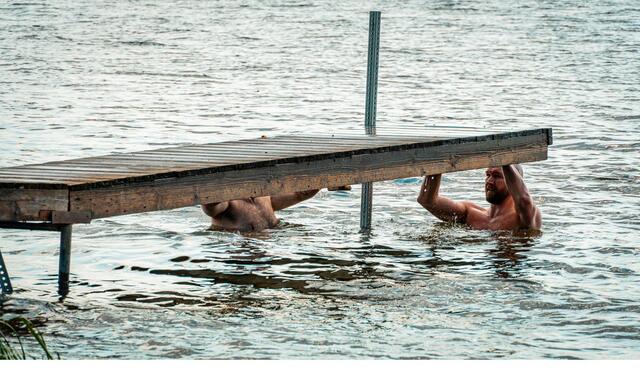 Hauling out onto the dock after a swim