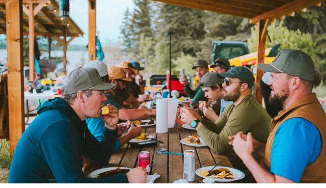 The long table under the gazebo at mealtime