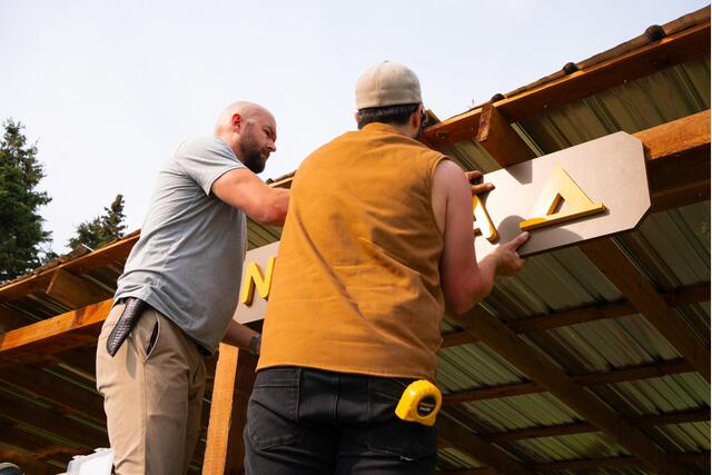 Installing the routed letters of the camp sign