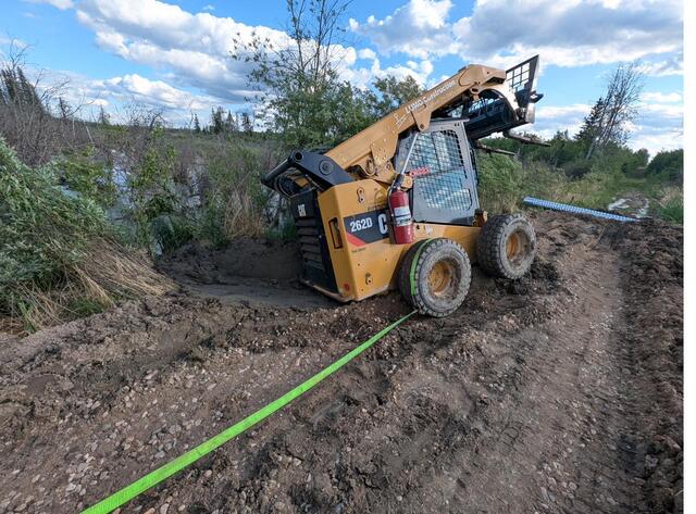 The skid steer meeting the swamp, and losing round one
