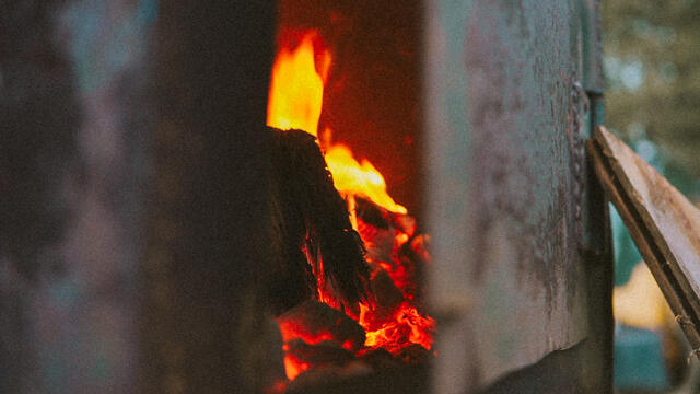The firebox burning down to cooking coals