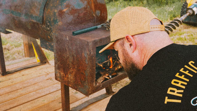 Tending the smoker through a long cook